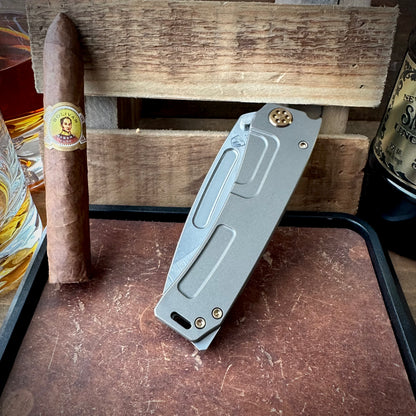 Medford Knife and Tool Marauder-H with S45vn Drop Point Blade, Old School Tumbled Rose Gold Titanium Handles, Rose Gold Hardware, and Standard Breaker - Anodized Pivot